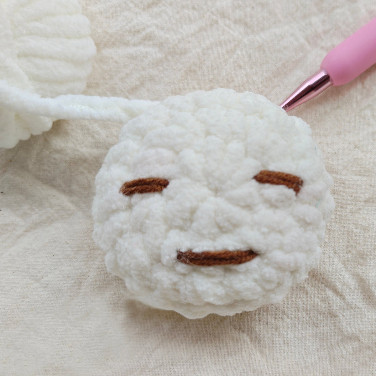 Close-up of Yuanchu handmade crochet character