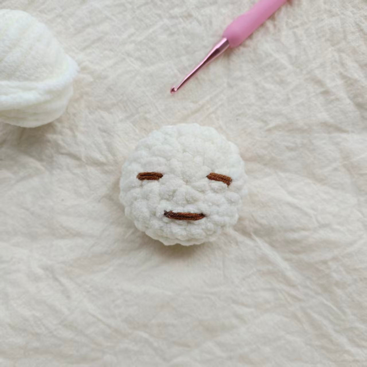 Yuanchu handmade crochet character with yarn and crochet hook